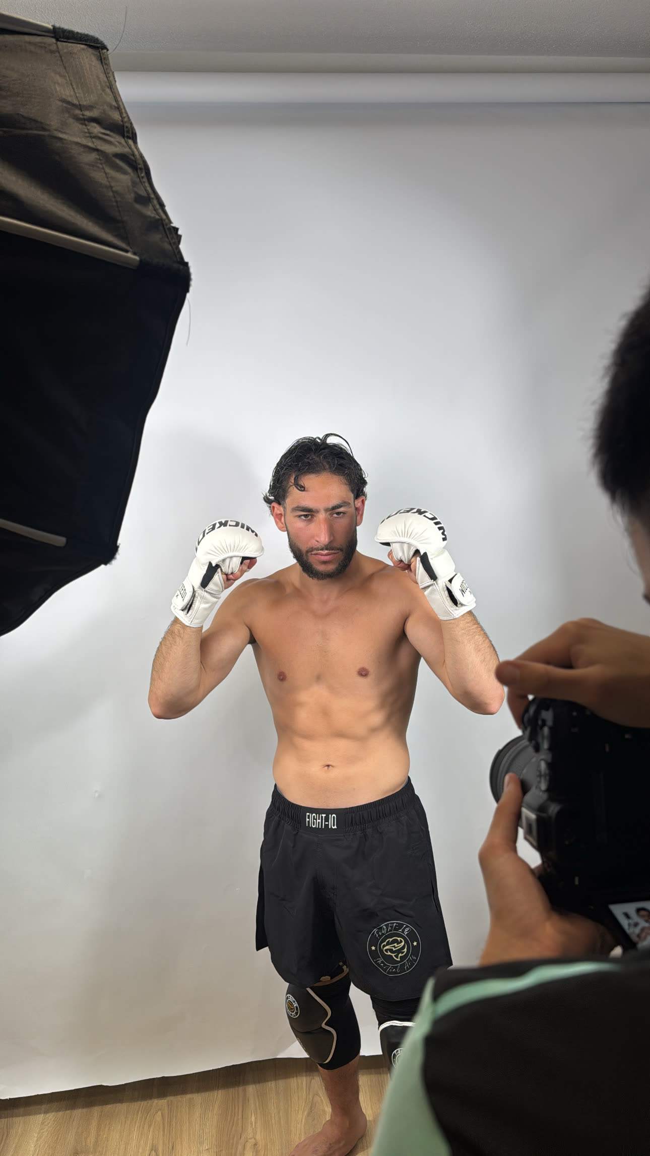 Athlete wearing RAGE GUARD black rashguard in guard position
