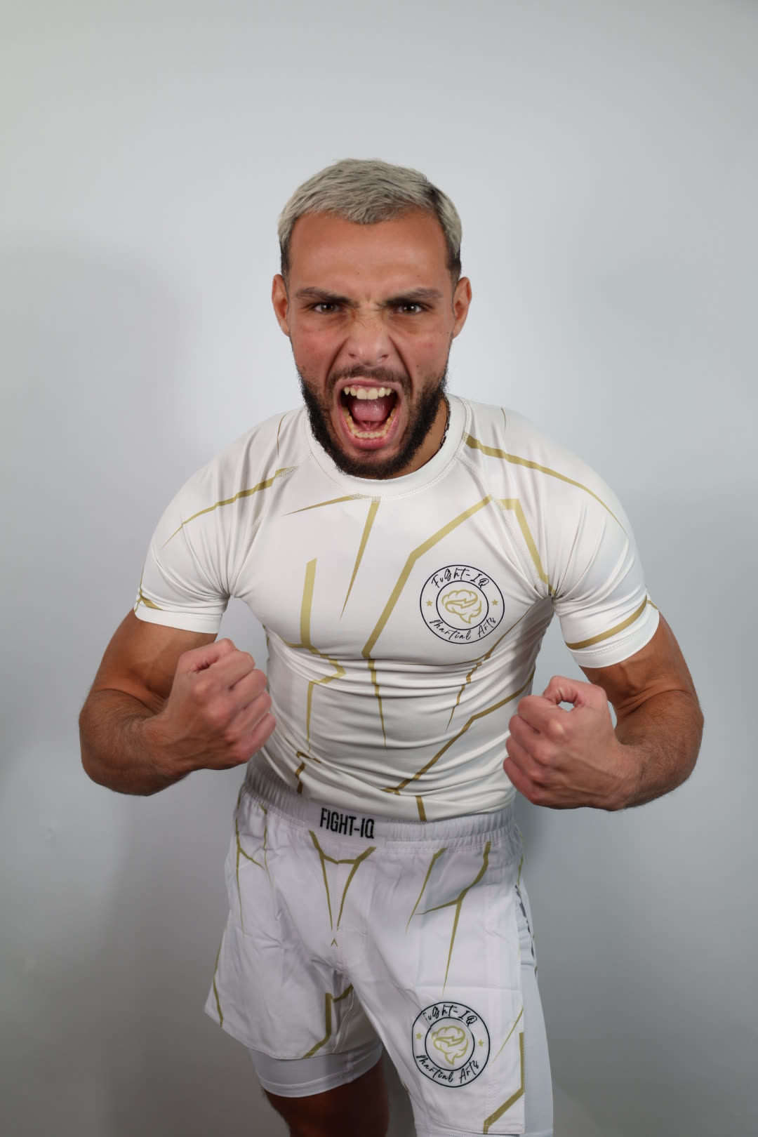 RAGE GUARD black and gold rashguard, back view