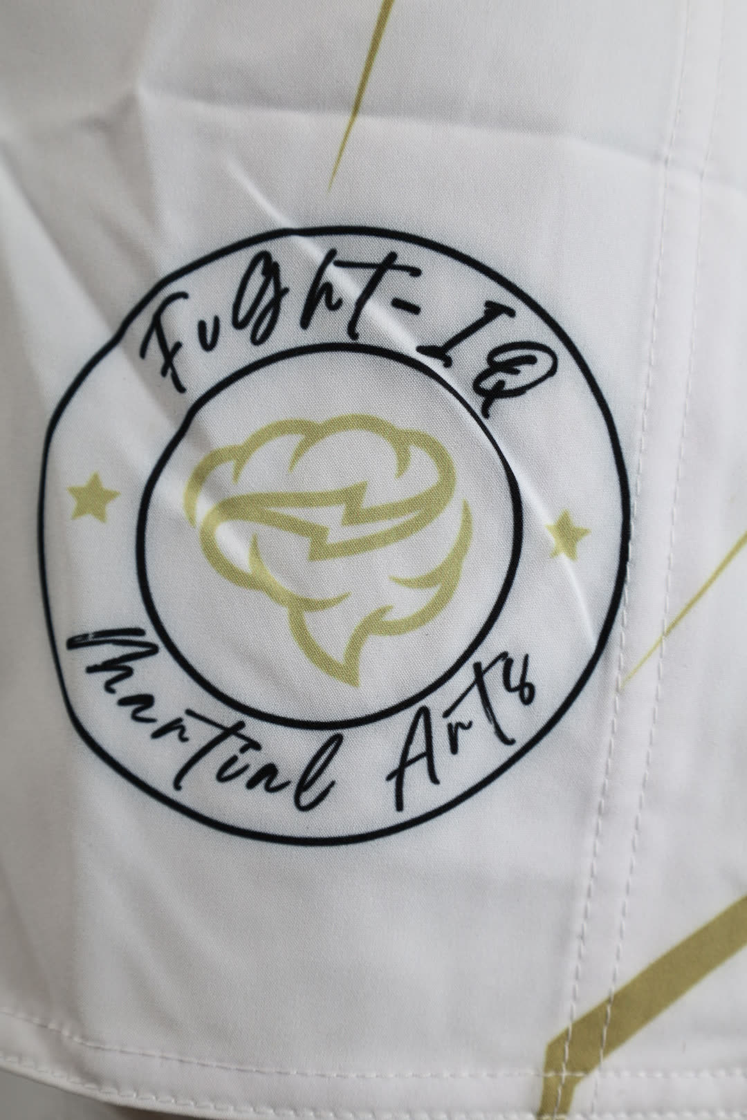 RAGE GUARD embroidered circular logo close-up